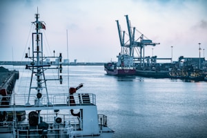 red and white ship on sea during daytime