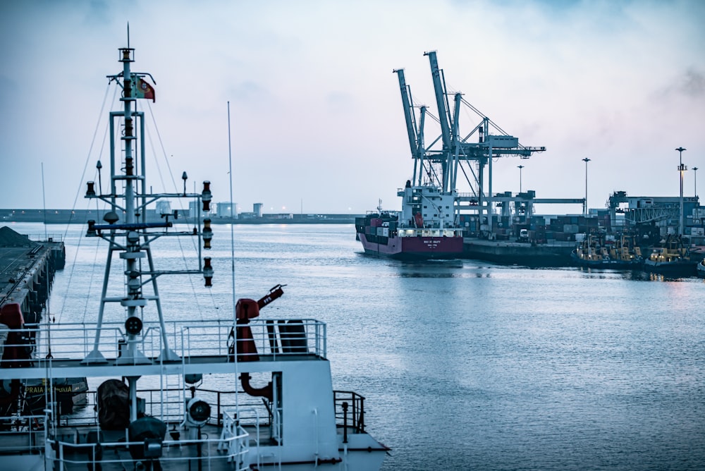 red and white ship on sea during daytime