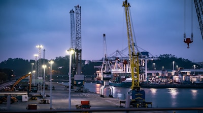 white and blue boat on dock during night time