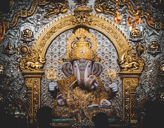 gold and blue hindu deity figurine