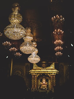 brass and crystal chandelier turned on during nighttime