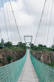 green and white bridge under white sky during daytime