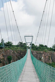 green and white bridge under white sky during daytime