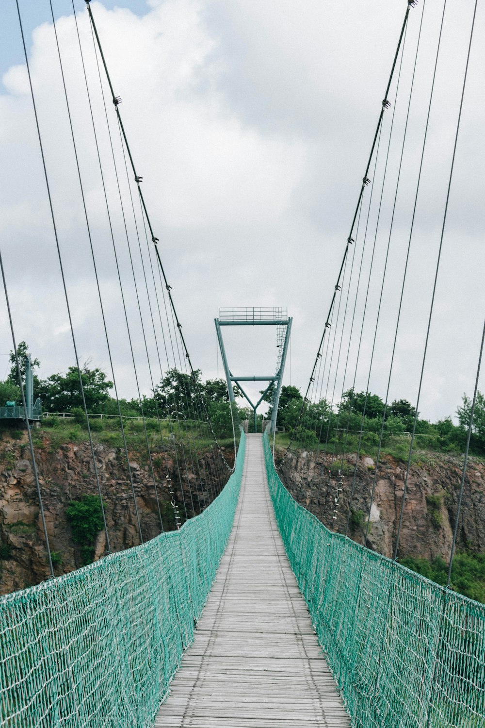 green and white bridge under white sky during daytime