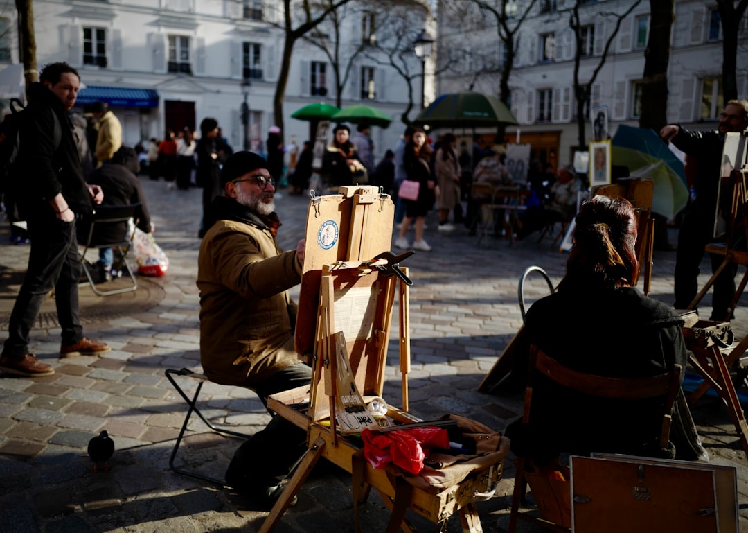 people sitting on chair near road during daytime