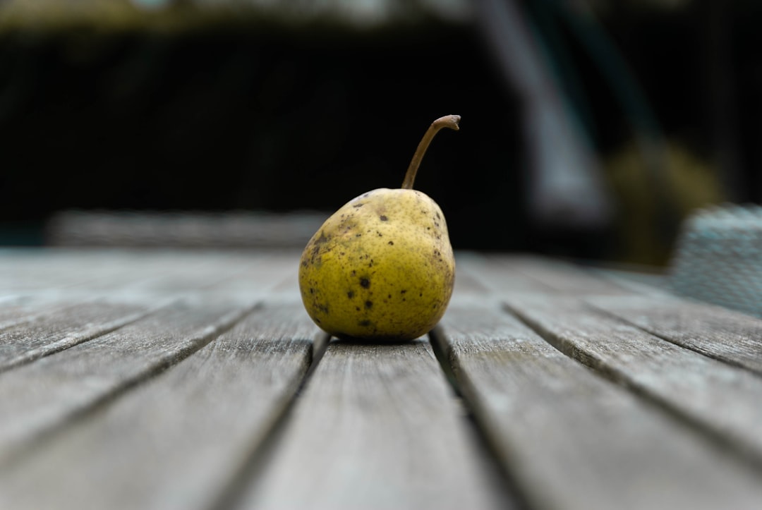 yellow fruit on brown wooden table