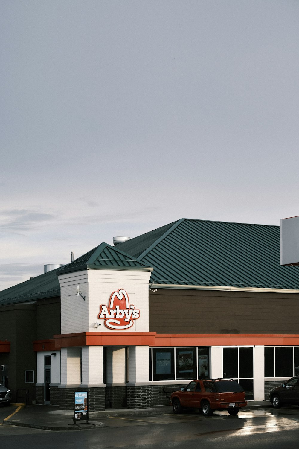 white and red concrete building under gray sky during daytime