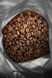 brown coffee beans on white plastic pack