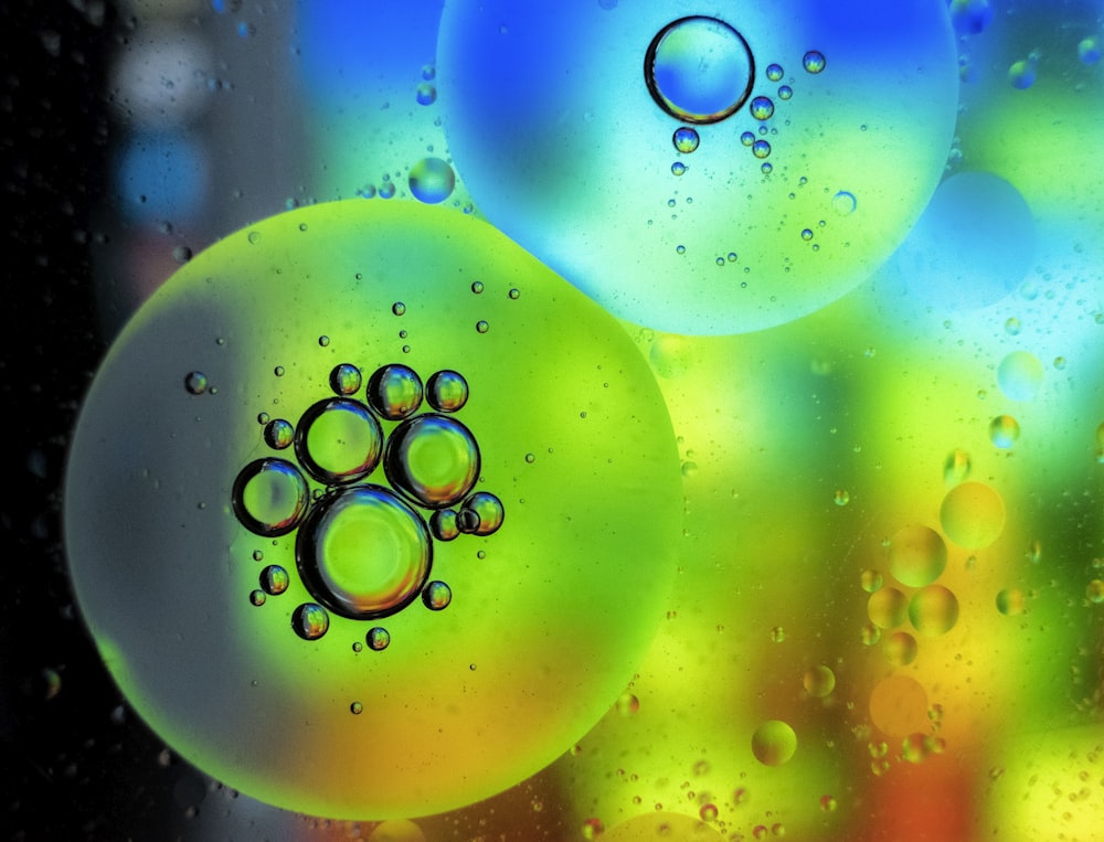 green and yellow bubbles with water droplets