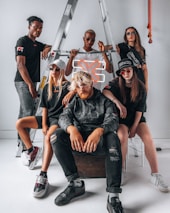 A diverse group of confident individuals styled in edgy streetwear, embodying self-expression.