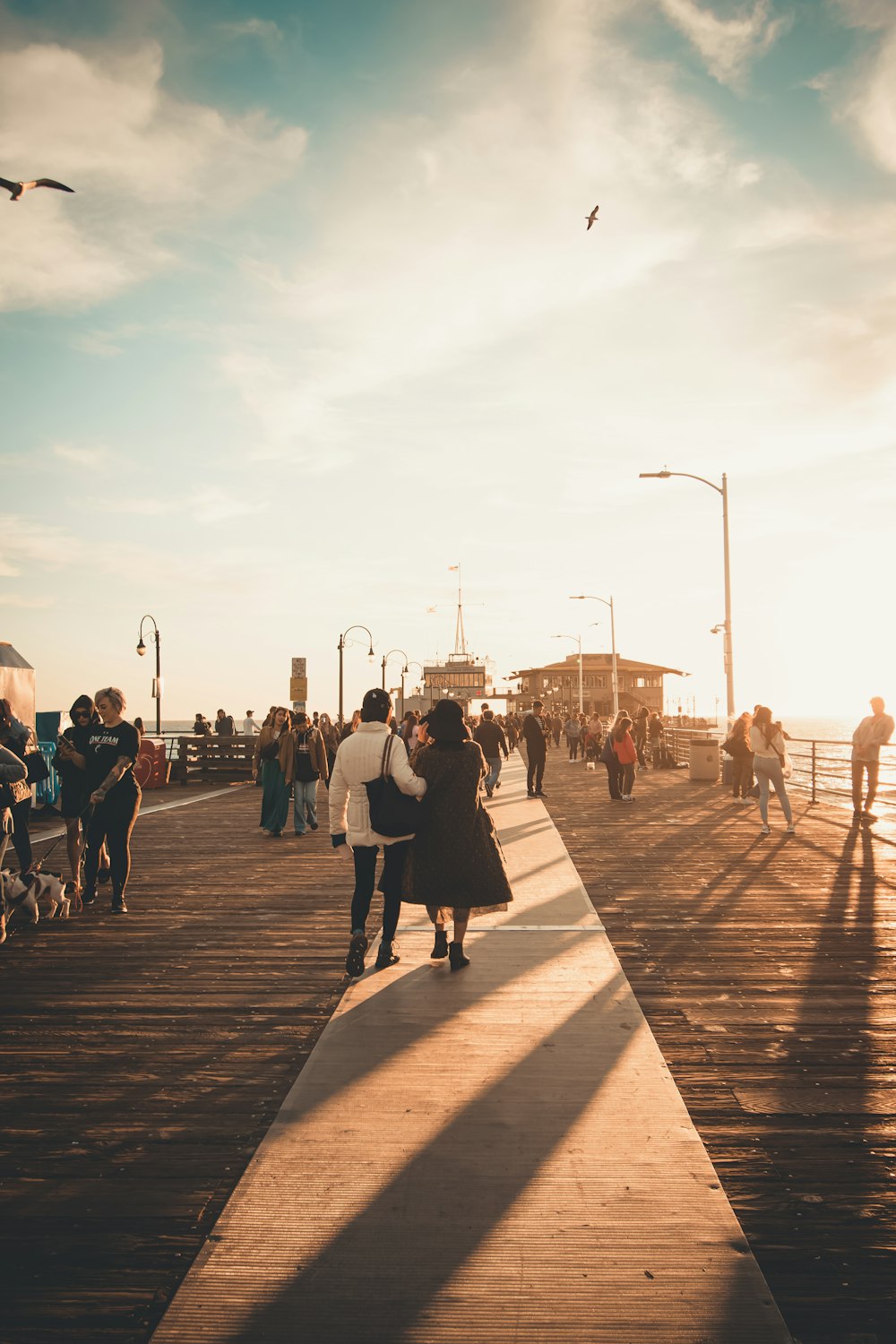 people walking on wooden dock during daytime