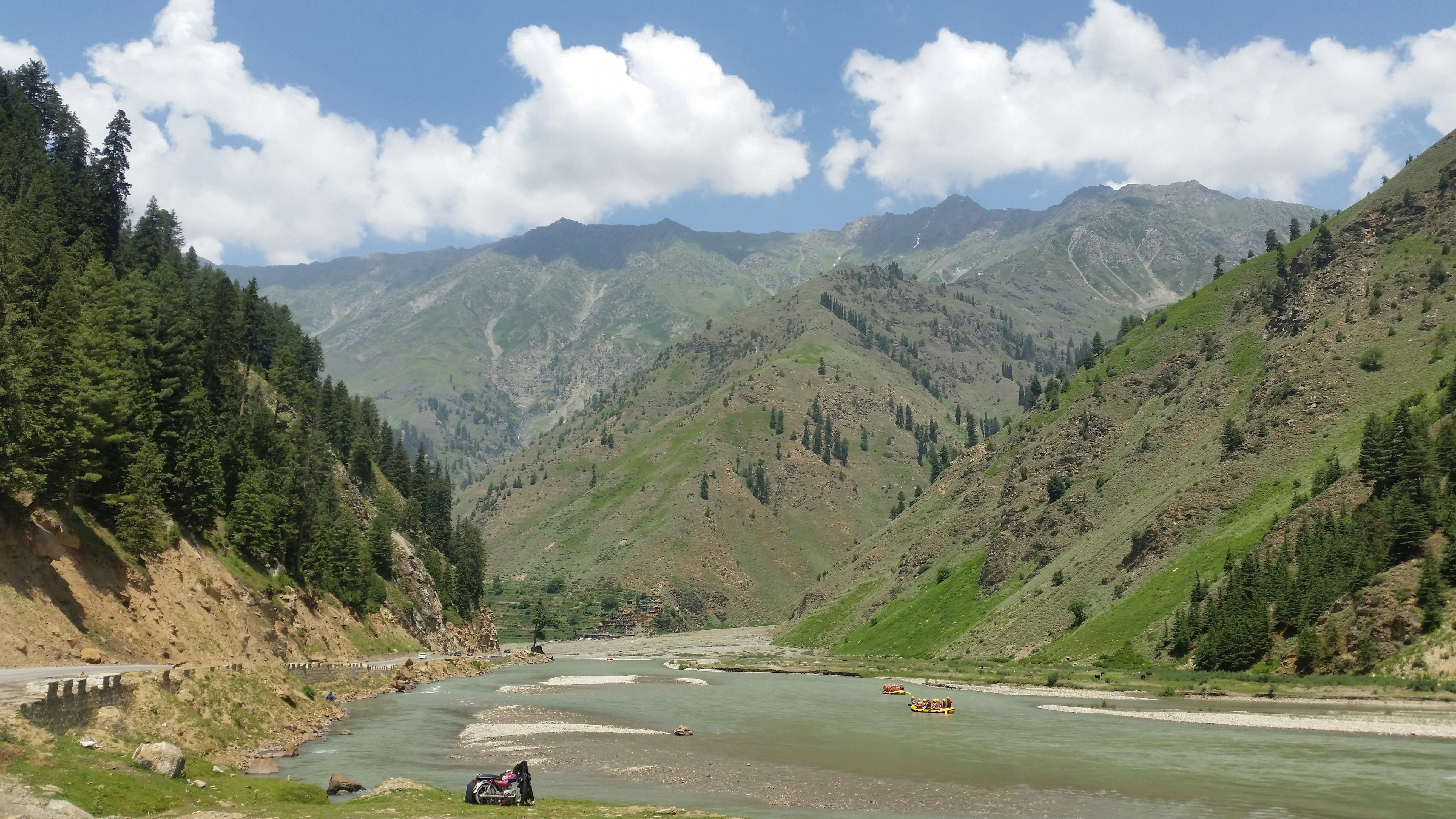 green mountains under white clouds during daytime