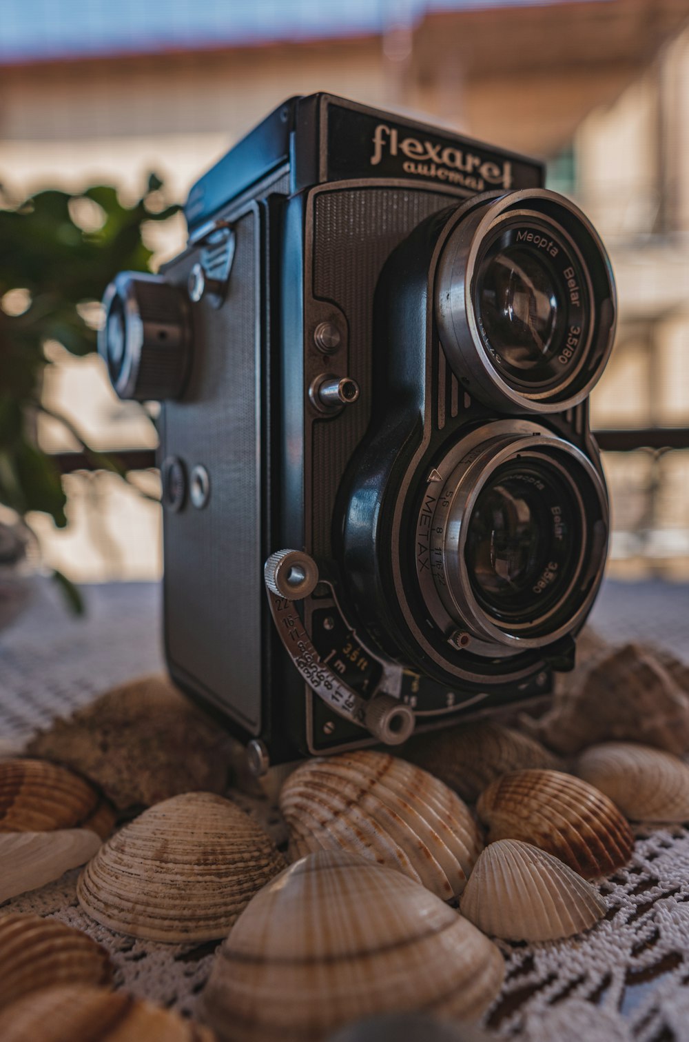 black camera on brown wooden table