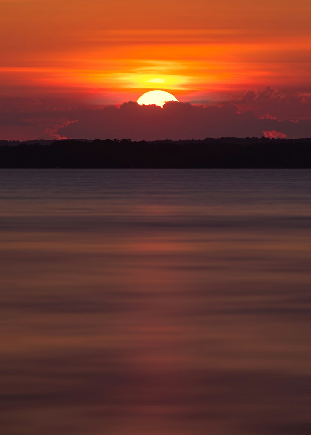 body of water during sunset