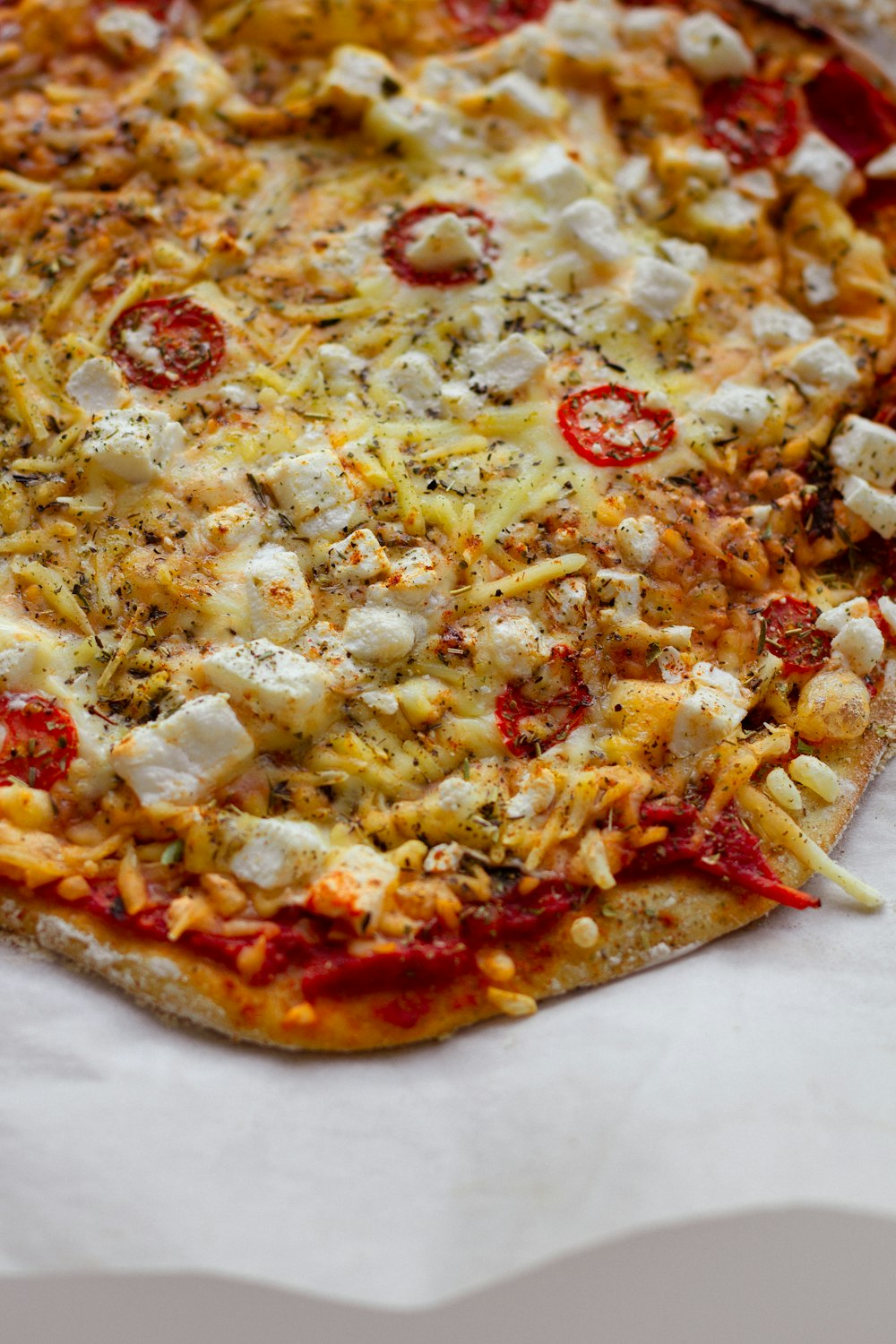 pizza with cheese and green leaves