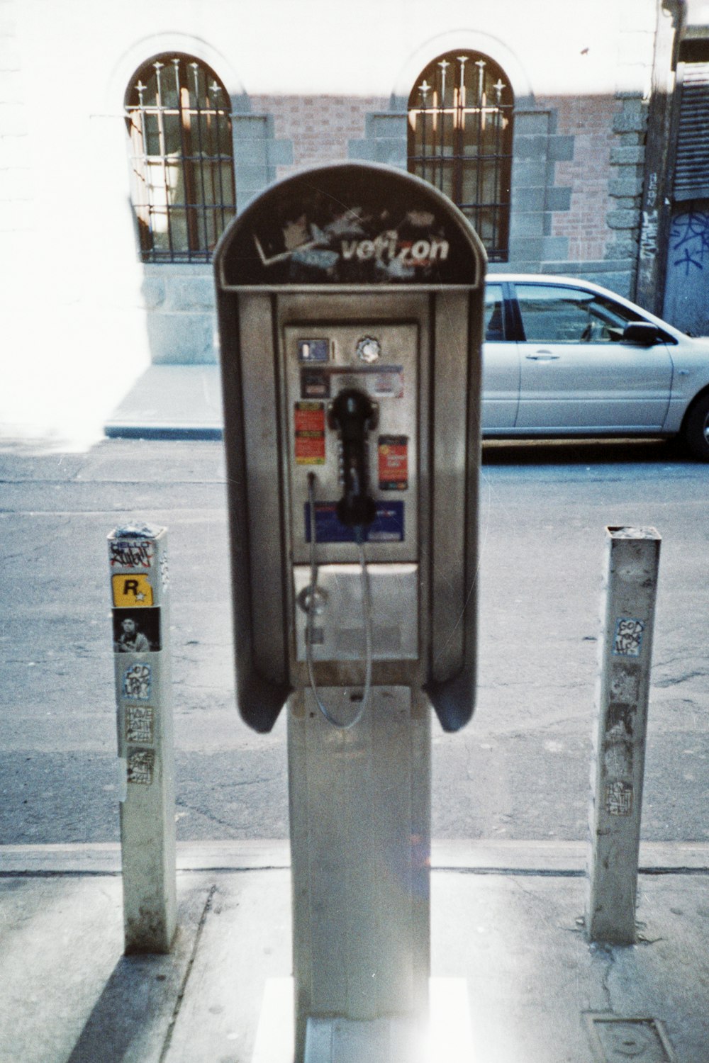 gray and black telephone booth