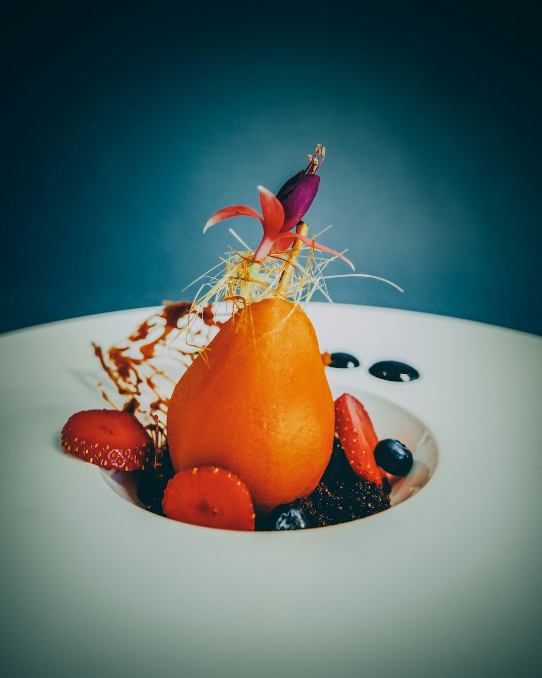 orange fruit on white ceramic plate