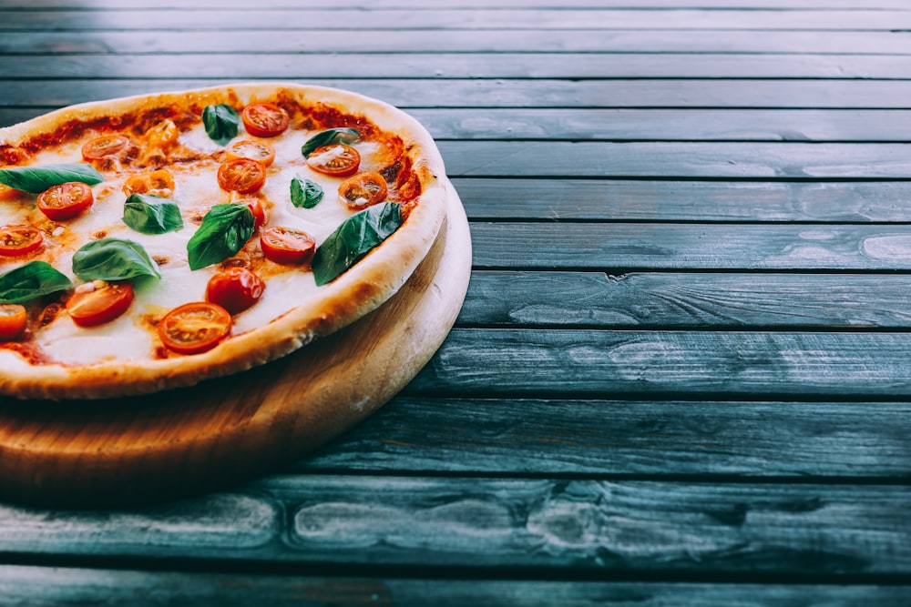 pizza on brown wooden table