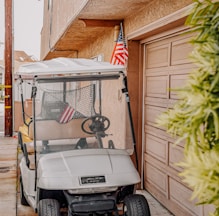 white golf cart with green grass