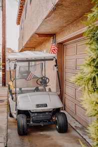 white golf cart with green grass