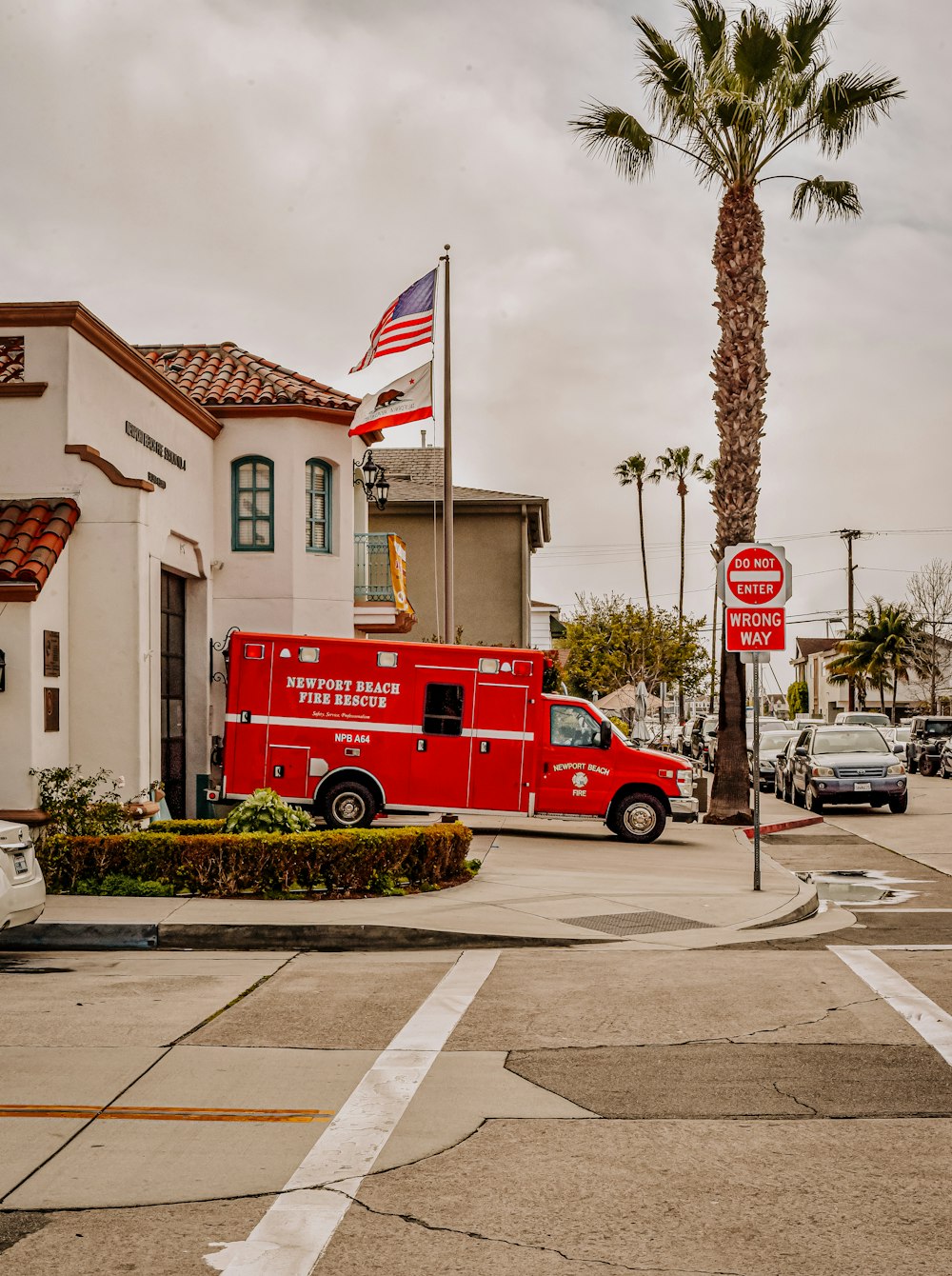 red and white coca cola van parked near white and brown concrete building during daytime