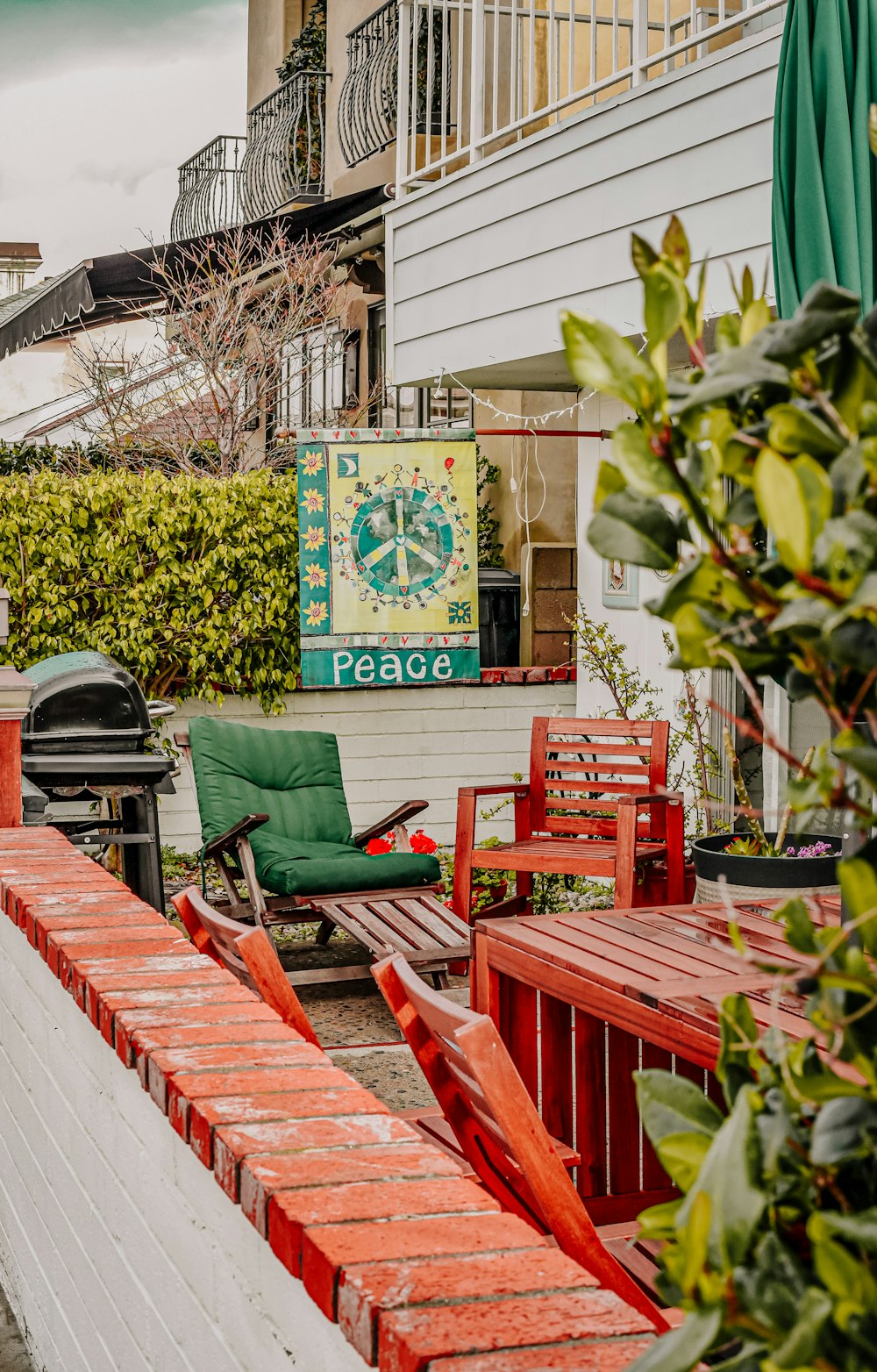 green and red wooden chairs and tables