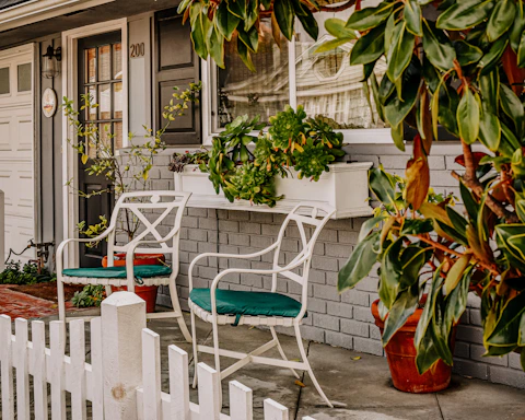 A welcoming front porch freshly cleaned, showing a crisp contrast between old grime and bright surfaces.