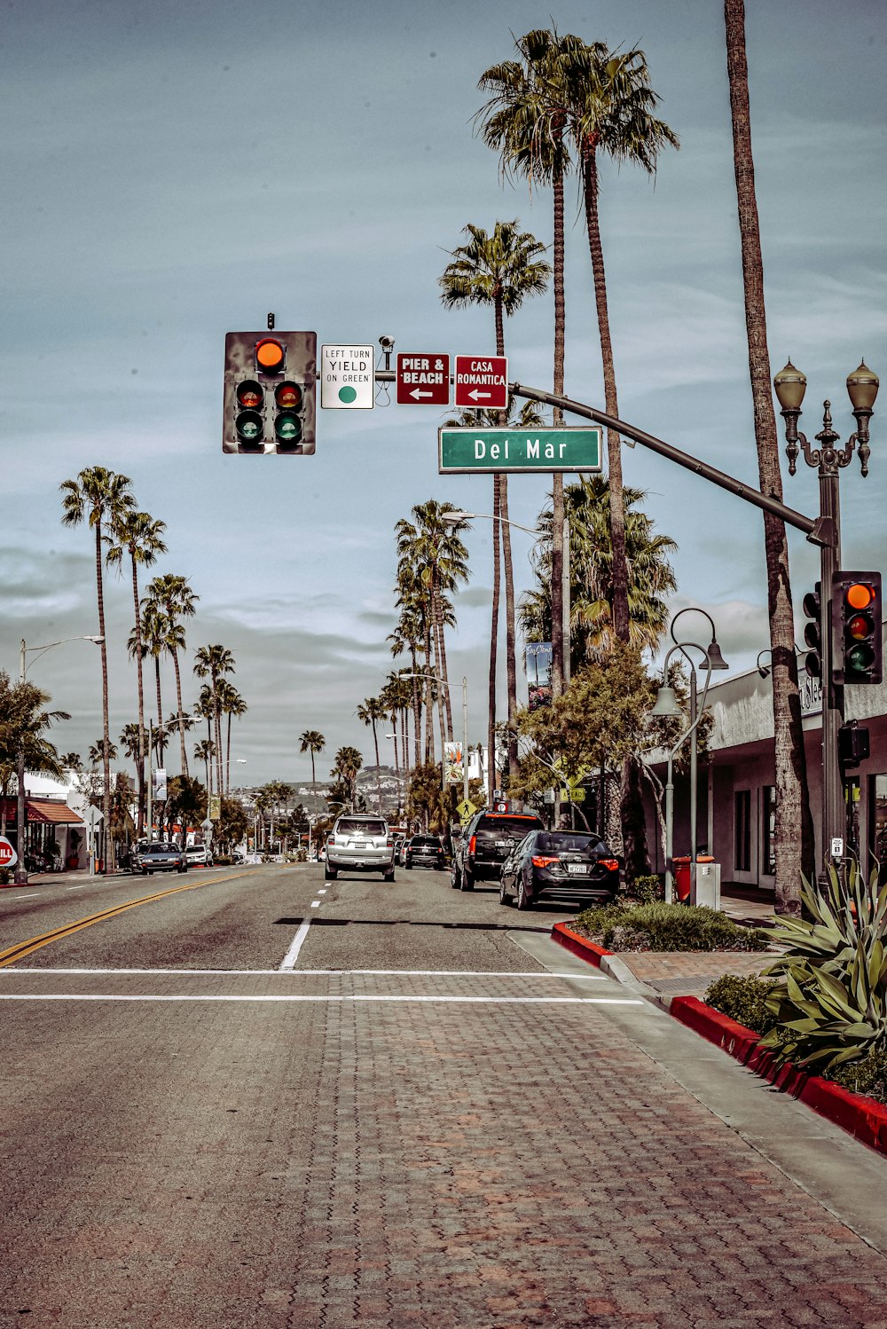 traffic light with red light on stop sign