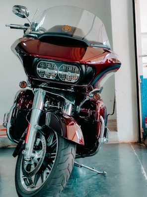 A shiny motorcycle securely strapped inside a transport truck in Bangalore.