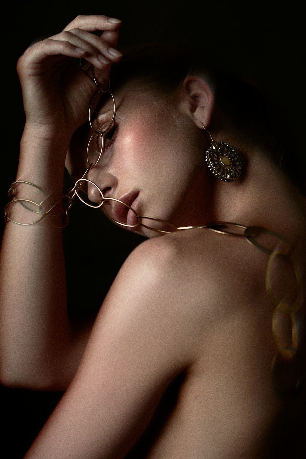 woman wearing silver and gold necklace