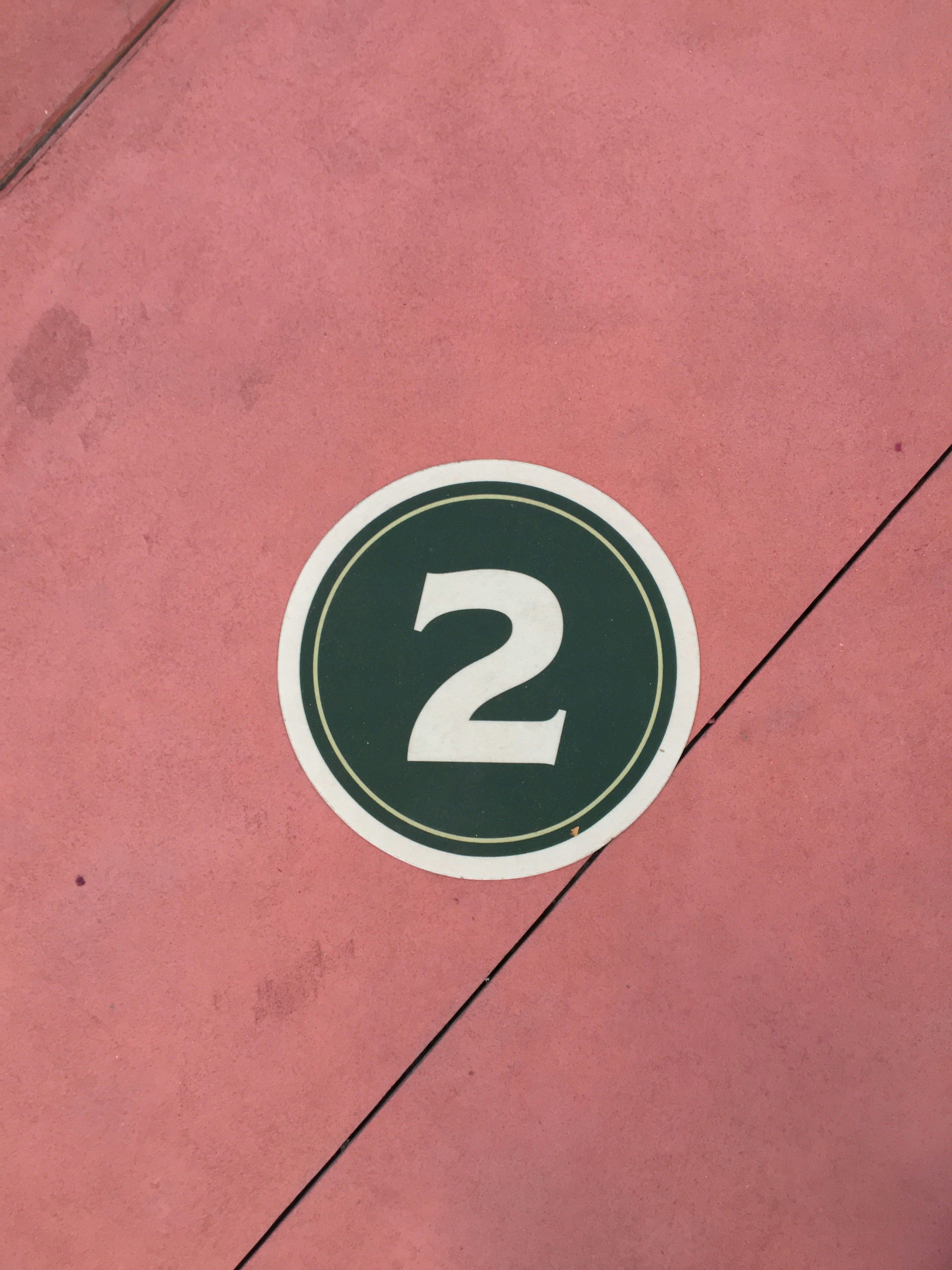 This is a floor sticker with the number 2 on it. Taken at the Magic Kingdom, DisneyWorld. 