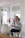 woman in white dress shirt sitting on chair