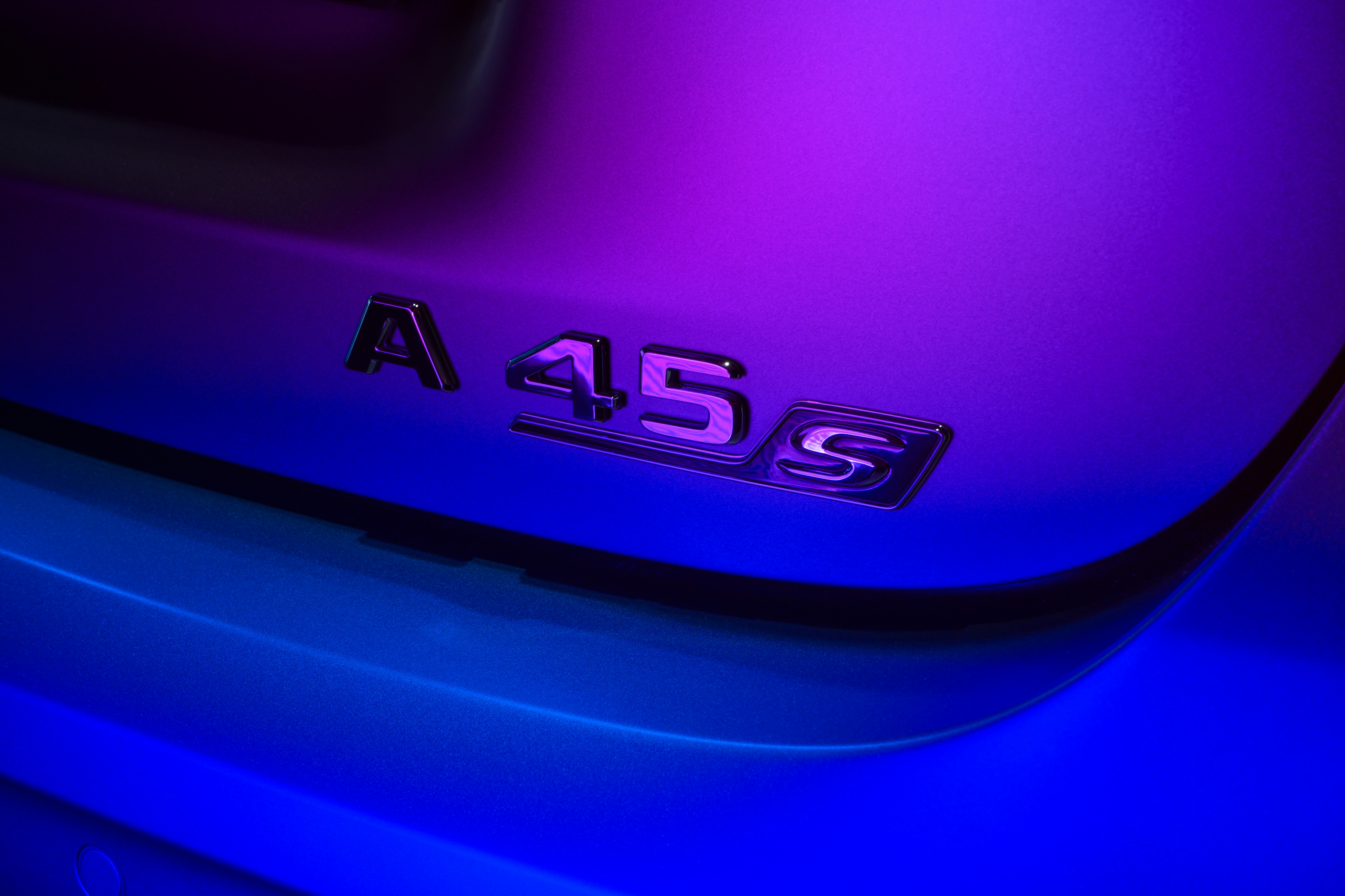 a close up of a purple and blue car