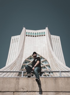 An influencer posing in front of a stunning architectural landmark.