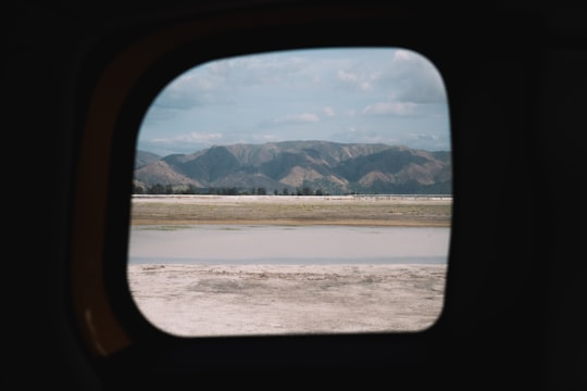 black car side mirror near body of water during daytime in Zambales Philippines