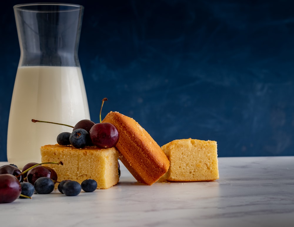 sliced bread and clear drinking glass on white table