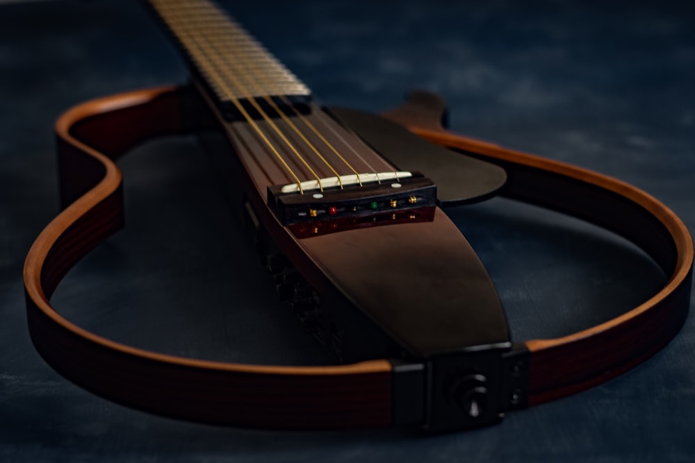 brown and black acoustic guitar