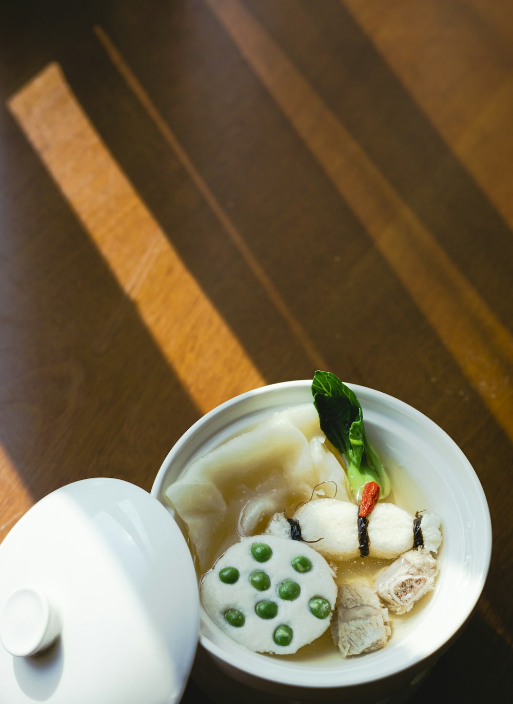 white ceramic bowl with sliced fruits