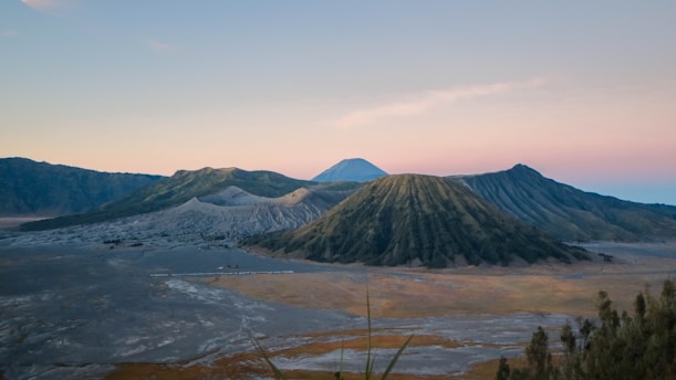 green and brown mountains under white sky during daytime