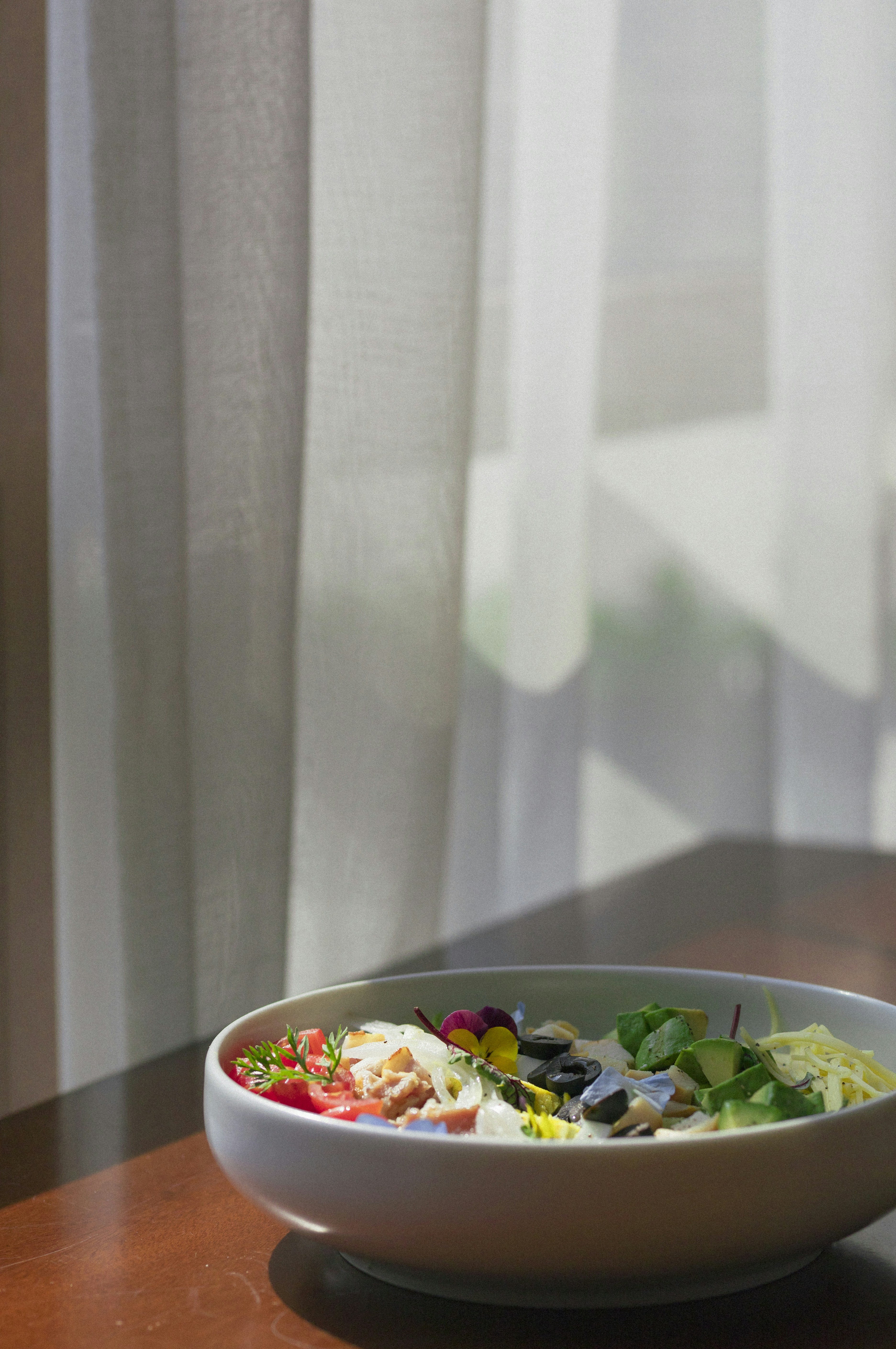 vegetable salad on white ceramic bowl