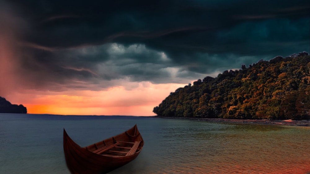 brown boat on body of water near green and brown rock formation during daytime