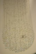 A collection of various chandelier parts displayed on a table.