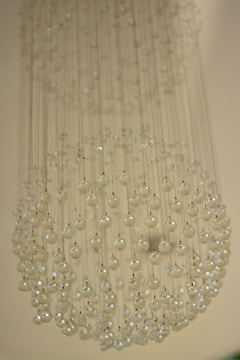 A collection of various chandelier parts displayed on a table.