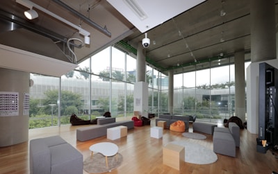 A spacious lounge with large windows and natural light.