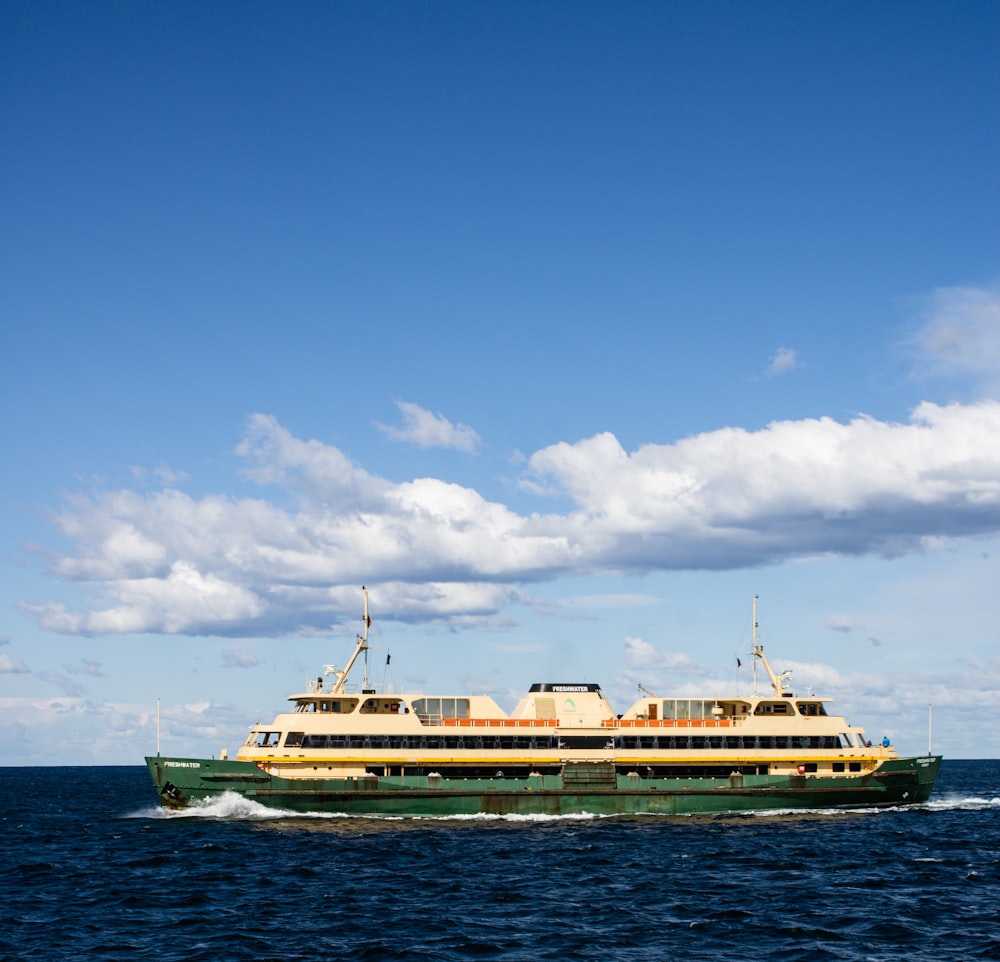 white cruise ship on sea under blue sky during daytime