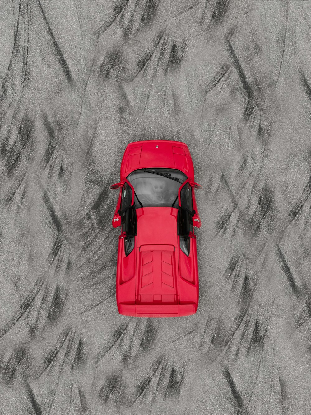 red car on gray scale