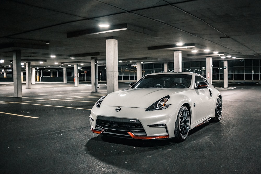 white porsche 911 parked in parking lot