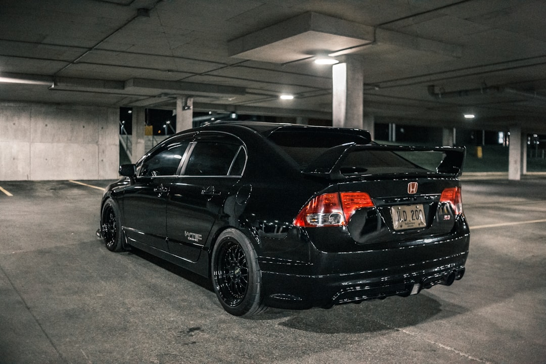black sedan parked on garage