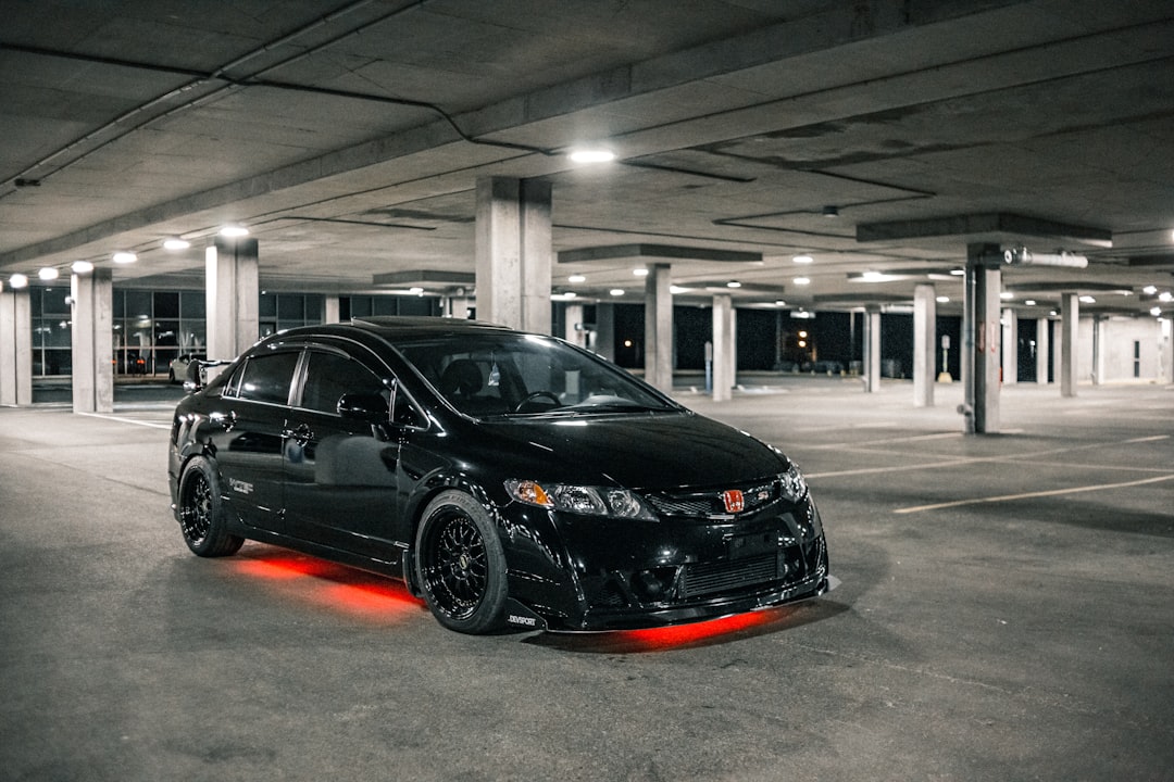 black mercedes benz coupe parked in parking lot