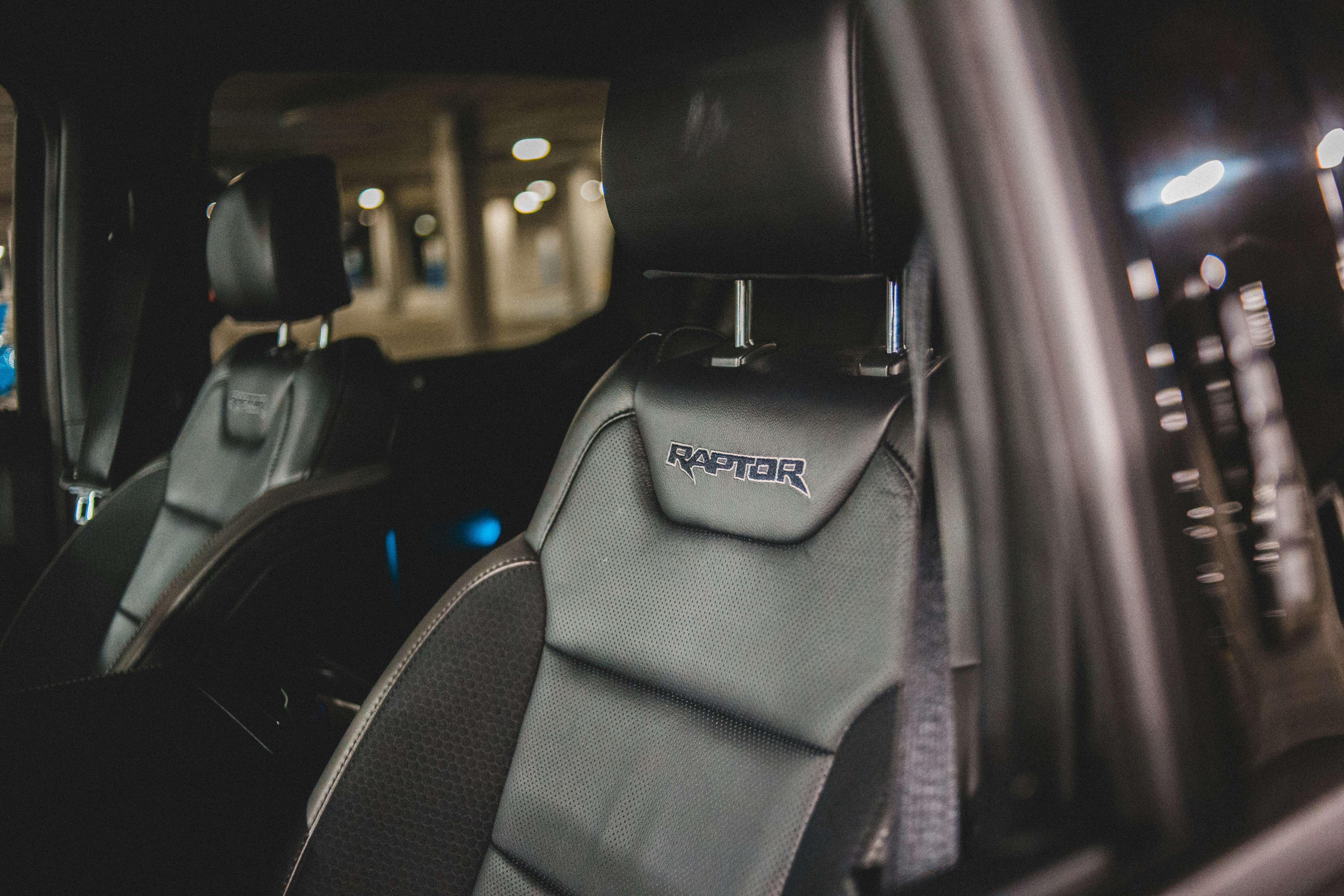 Range Rover plug‑in hybrid SUV charging at a home wallbox in a modern driveway